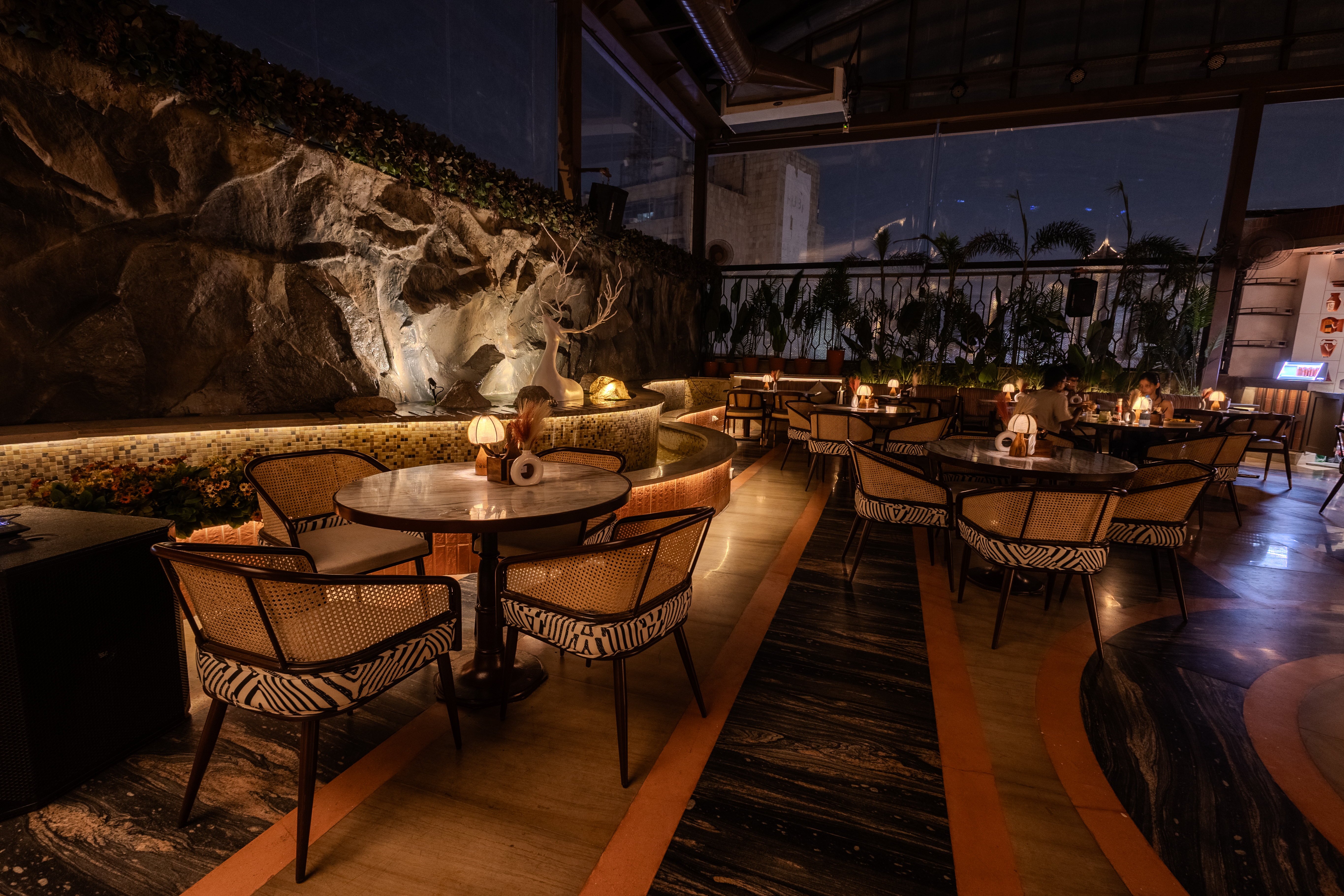DAINA illuminated water fountain dining terrace
